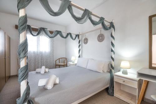 Postel nebo postele na pokoji v ubytování Nikolas Apartment
