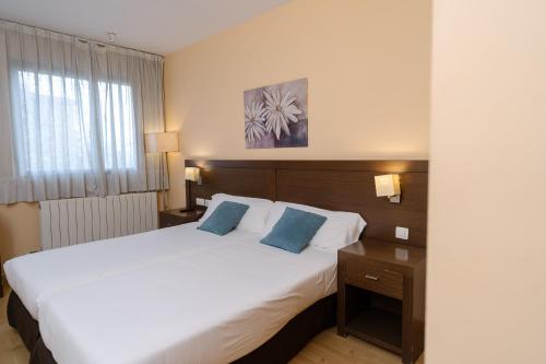 Postel nebo postele na pokoji v ubytování Hostal Acanto