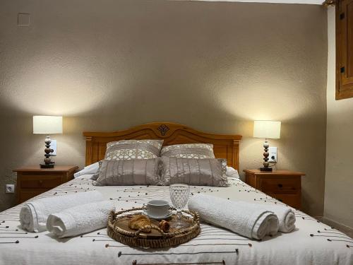 a bedroom with a bed with a basket on it at CASA RURAL MASIA ARINESA Culla in Culla