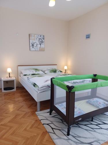 Postel nebo postele na pokoji v ubytování Nena City Center Apartment