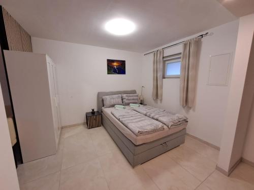 a bedroom with a bed and a window in it at Ferienwohnung Selo A in Coppenbrügge