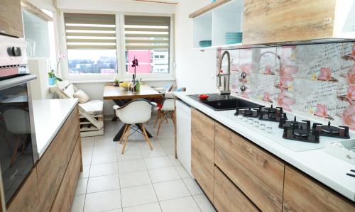 a kitchen with a sink and a counter at Nensica in Vukovar