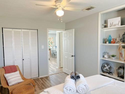 a person laying on a bed in a living room at 360 Selfie Seaside Spot- Ocean Beach Bridge in Freeport