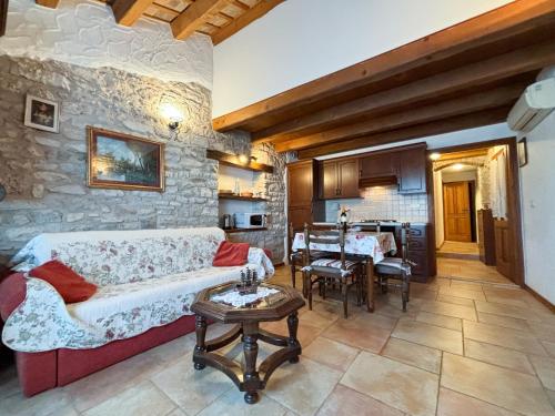 a living room with a couch and a table at City Center Coastal Escape - Apartments with Sea View or Cozy Room in Novigrad Istria