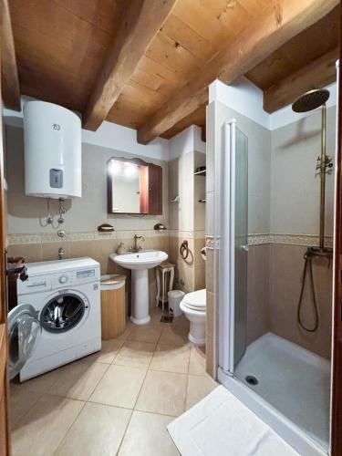 a bathroom with a washing machine and a sink at City Center Coastal Escape - Apartments with Sea View or Cozy Room in Novigrad Istria