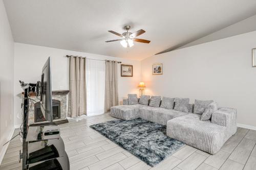 a living room with a couch and a tv at 8 Mi to Legoland Winter Haven Home with Lanai! in Winter Haven