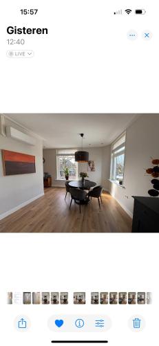 a picture of a living room with a table at Prachtig en ruim appartement in centrum Lochem in Lochem