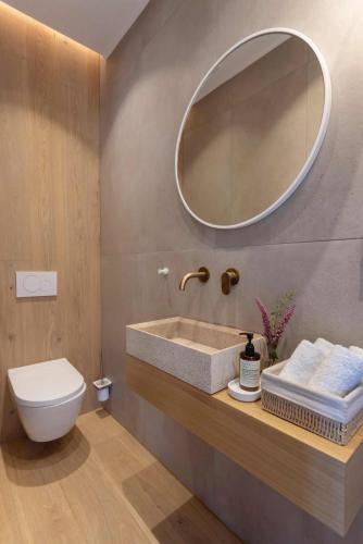 a bathroom with a sink and a mirror at OD Luxury Villa in Pylos