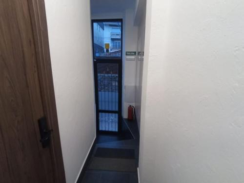 a hallway with a stairway in a building at Lujo en la Sierra in Becerril de la Sierra