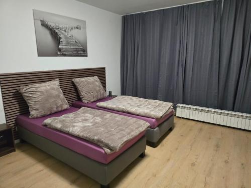 Postel nebo postele na pokoji v ubytování AlSa Apartments