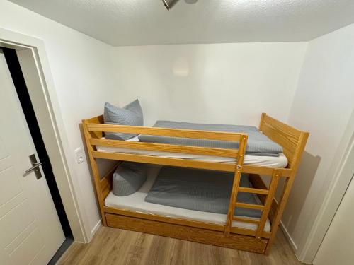 a room with a bunk bed in a room at Gipfelblick Apartment in Goslar