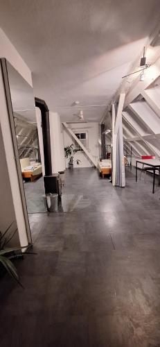 an empty room with tables and chairs in a building at Blumenblick in Kirchhain