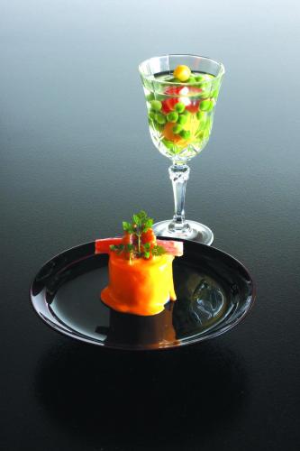a plate with a glass of wine and a piece of food at Yoshimatsu in Hakone
