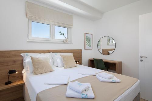 Giường trong phòng chung tại Dada Luxury Apartment A2