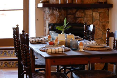 a wooden table with food on top of it at Agroturismo Finca Son Pieras in Llucmajor