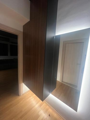 an empty room with a wall and a door at Demo Apartments Black II in Bitola