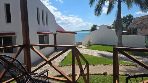 a view of the ocean from the balcony of a house at bacalar My Love Front Laguna in Bacalar
