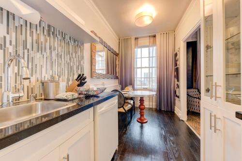 a kitchen with a sink and a counter at Inn at the Park in San Diego