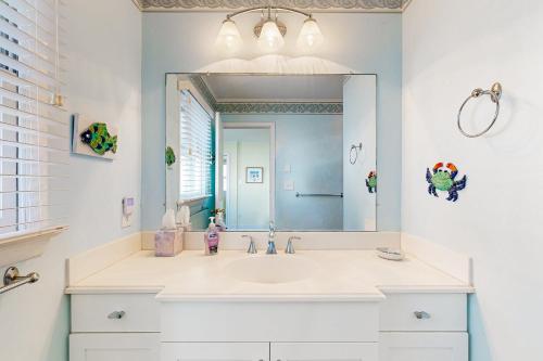 a bathroom with a sink and a mirror at South Bethany --- 104 Brandywine St in Bethany Beach
