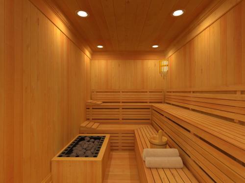 a sauna with wood paneling and a wooden floor at Shiv Vilas Resort in Jaipur