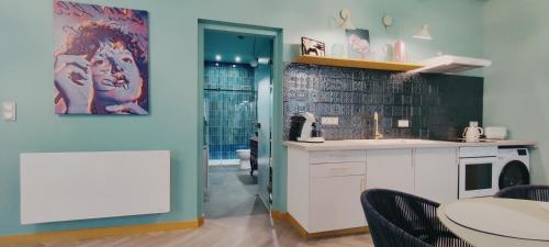 Η κουζίνα ή μικρή κουζίνα στο Appartements design - Uniques - Centre
