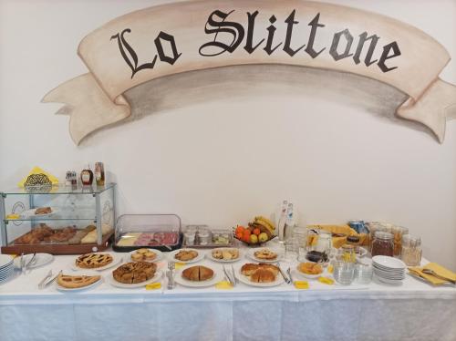 a table with a buffet of food on it at B&B Lo Slittone in Abetone