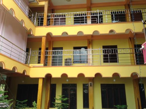 an external view of a building with balconies at Sunshine Hotel in Trincomalee