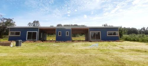 a house is being built in a field at AltaVista Lago Ranco in La Unión