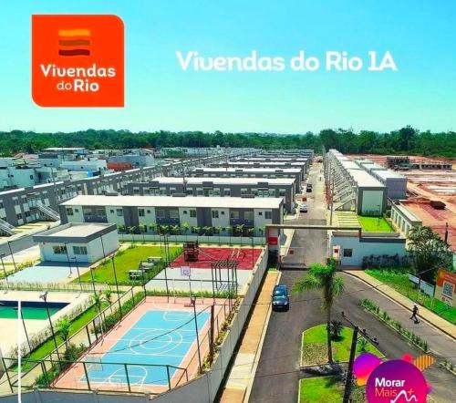 arial view of a parking lot of a building at Apartamento Cop 30 in Ananindeua