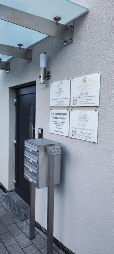a building with a mail box on the side of it at Apartments Seibel Doppel-Zweibettzimmer mit Balkon in Reutlingen