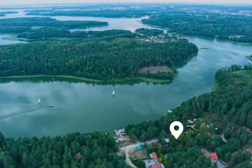 an aerial view of a lake with a heart at Wilkaski zakątek in Giżycko