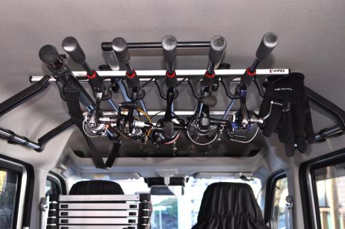 a rack in the back of a van with utensils at AJITO in Oshima