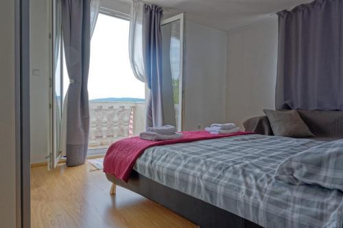 Postel nebo postele na pokoji v ubytování Apartman Gizdavac
