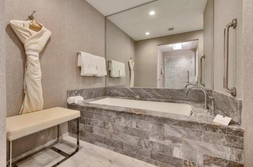 a bathroom with a large tub and a sink at Stylish 1 BR at Fort Lauderdale in Fort Lauderdale
