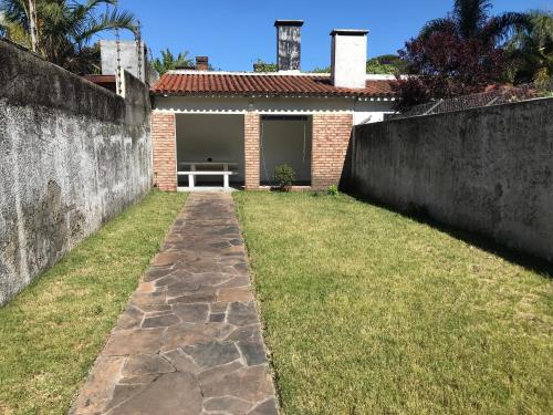 a walkway in front of a house at Large 2 floors in Carrasco in Montevideo