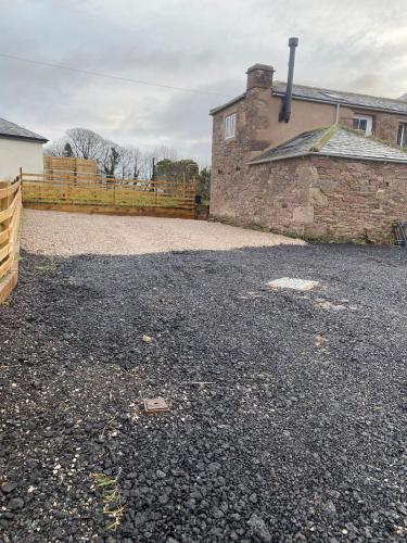 an empty driveway in front of a house at South View Cottage in Penrith