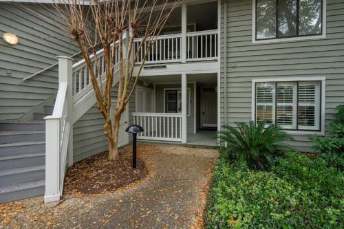 a house with a deck and a porch at Windsor Court - 12B in Spartanburg