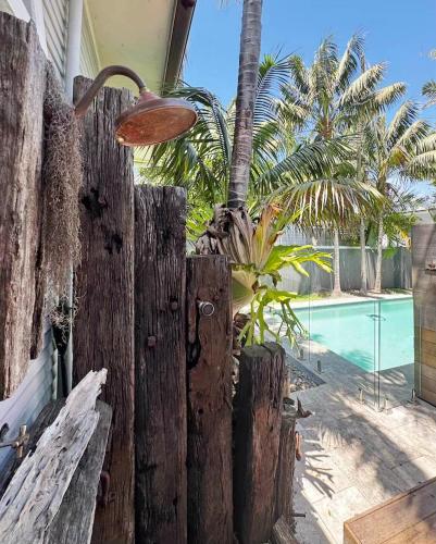 a wooden fence in front of a swimming pool at Newport Oases in Newport