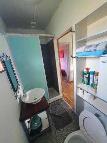 a small bathroom with a sink and a toilet at Bungalow B1 in Kumak