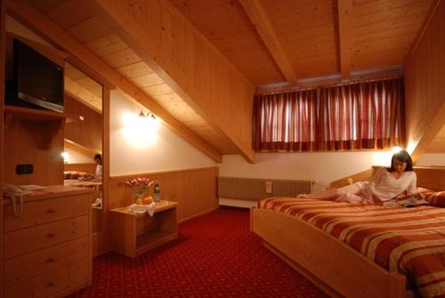 Postel nebo postele na pokoji v ubytování Sport Hotel Sass Maor