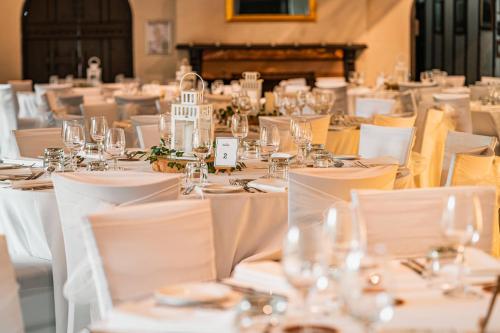 a table set up for a wedding with white tables and chairs at St Francis Winery in Old Reynella