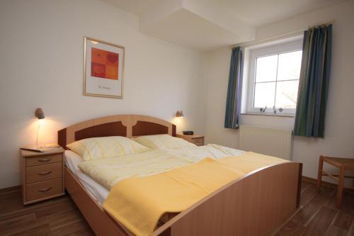 Katil atau katil-katil dalam bilik di Traberhof - Landurlaub in seiner schönsten Form - freies Reiten inbegriffen - Hunde willkommen - Sauna im Haus - Kanuverleih - tolle Radwege - Deich in Sichtweite