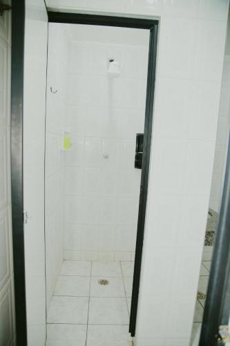 a shower with a glass door in a bathroom at HOTEL ROYAL PARK in Piracicaba