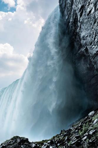a waterfall is coming out of a mountain at Guest House Room No 01 in Mississauga
