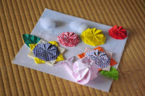 a group of different colored doughnuts on a table at Nisshokan Bettei Koyotei in Nagasaki