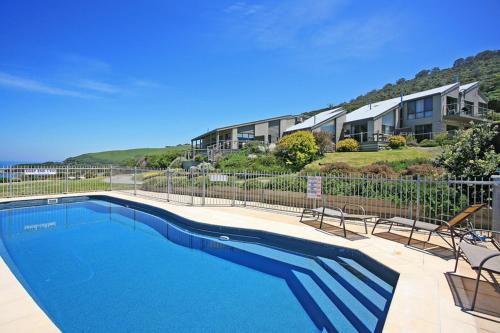 a swimming pool in front of a house at 13 Whitecrest Great Ocean Road Resort - Ocean Views in Wongarra