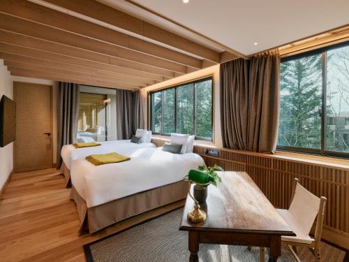 Postel nebo postele na pokoji v ubytování Glamdy style hotel suite 山ノ麓