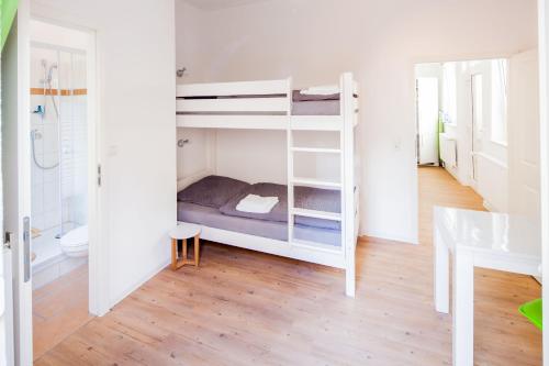 Ένα ή περισσότερα κρεβάτια σε δωμάτιο στο SecondHome Stuttgart - Moderne große Wohnungen nahe der hist Altstadt von Esslingen aN - versch Größen 8 - 11 - 19 Betten