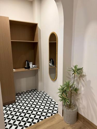 a room with a black and white checkered floor at K'TY Homestay Phan Thiết in Ấp Bình Hưng