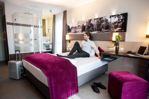 Amalienburg - Boutique & Boarding Hotelにあるベッド